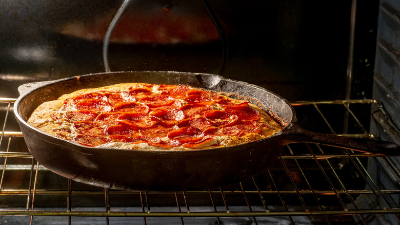 Deep dish pizza in oven