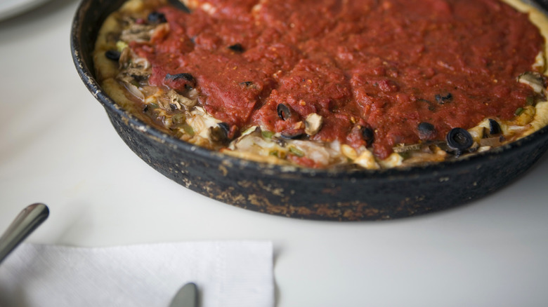 Deep dish pizza on table