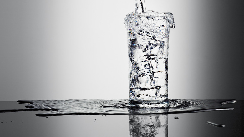 Water in glass on gray