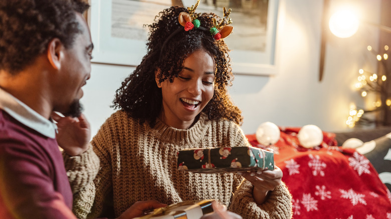 People exchanging Christmas gifts