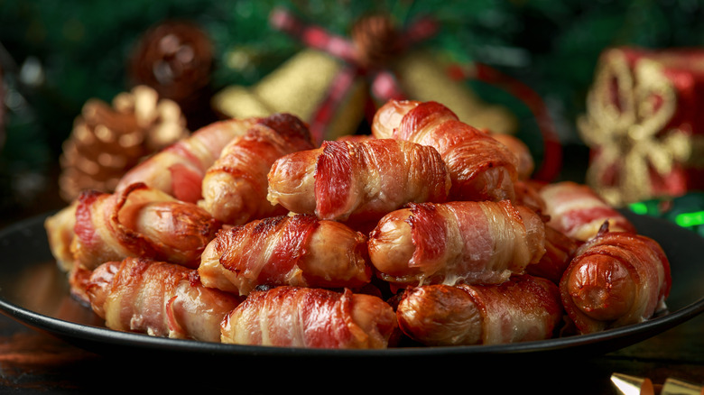 Bacon-wrapped wieners on plate