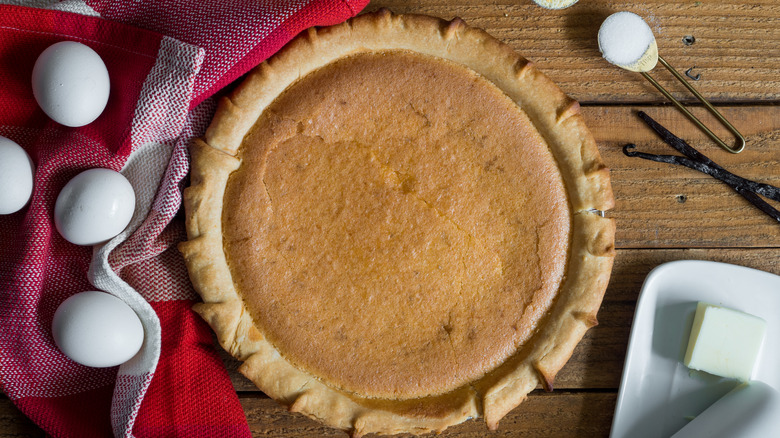 Pie on table eggs cloth