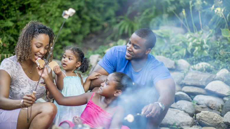 family roasting marshmallows