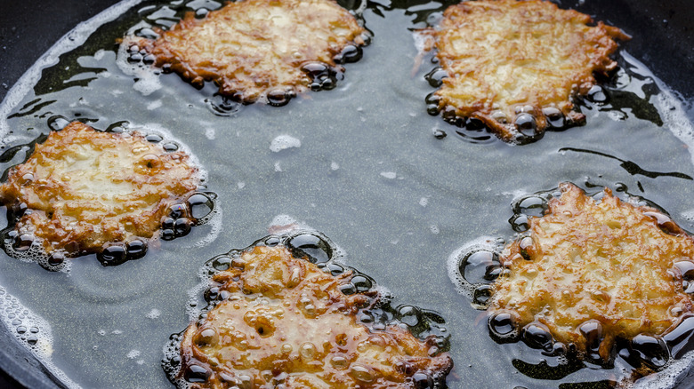 Latkes frying in oil