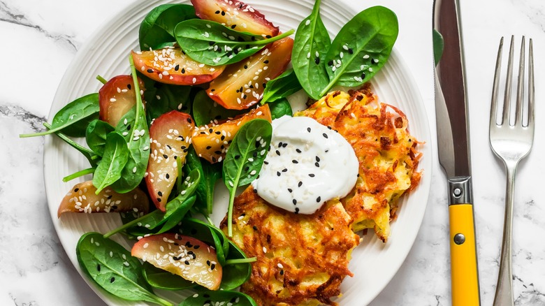 Latkes with apple spinach salad