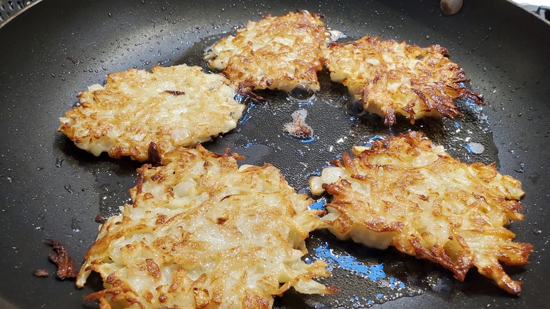 Frying latkes in pan oil