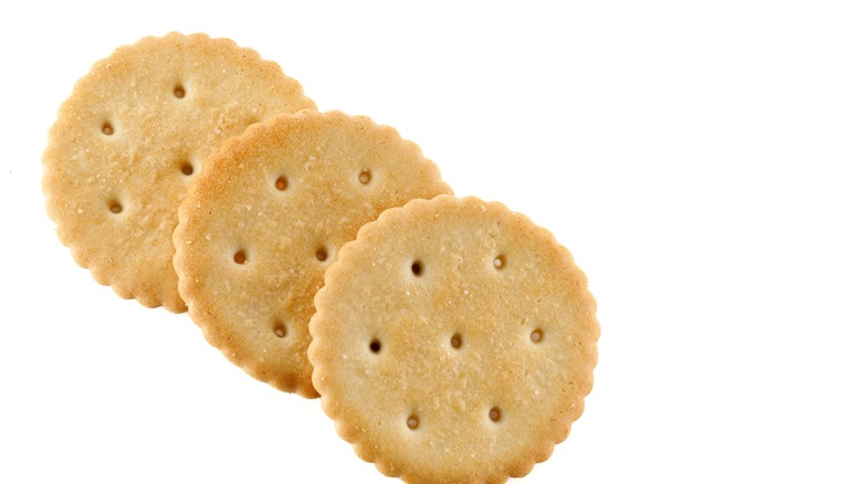 Whole wheat crackers on white background