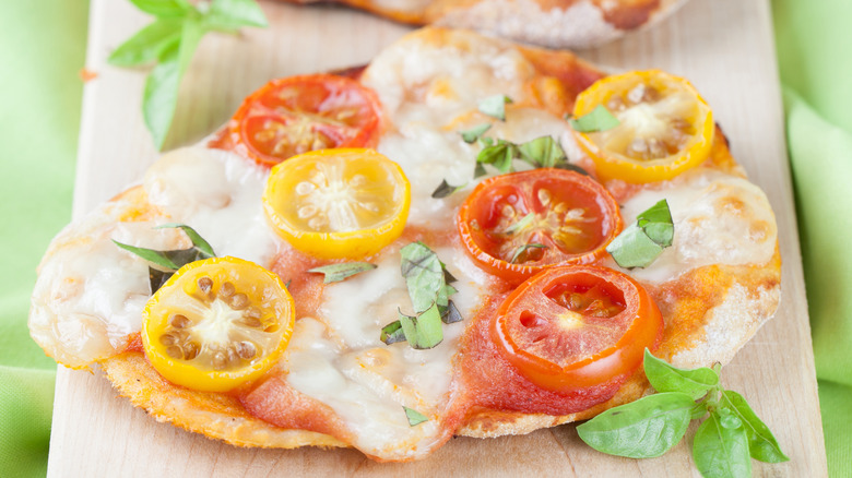 Mini pizzas with cherry tomatoes