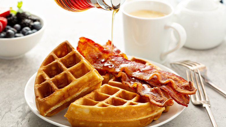 Waffles with bacon on plate