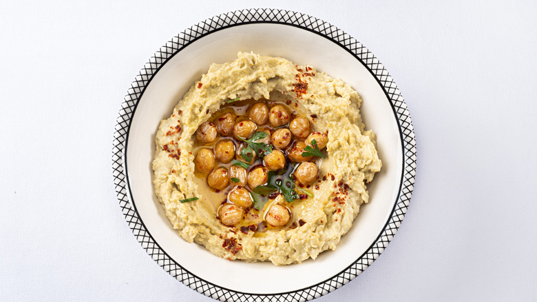 Hummus in a bowl with chickpeas