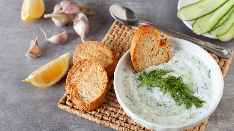 Tzatziki in bowl with bread