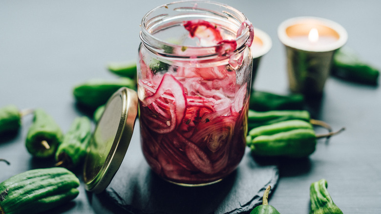 Red onions in a jar