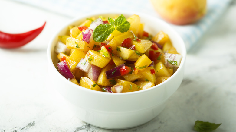 Chunky fruit salsa in white bowl