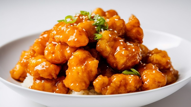 sesame orange chicken piled on a plate