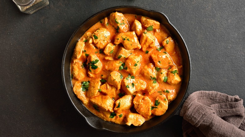 chicken tikka masala curry in cast iron pan