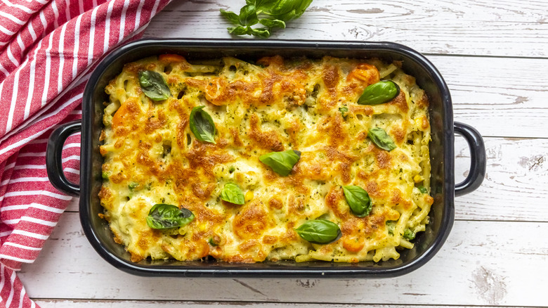 noodle casserole in a dish on wooden surface