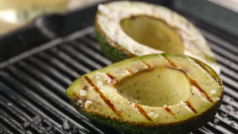 sliced fresh avocado on grill