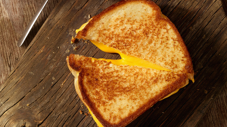 grilled cheese on wooden background