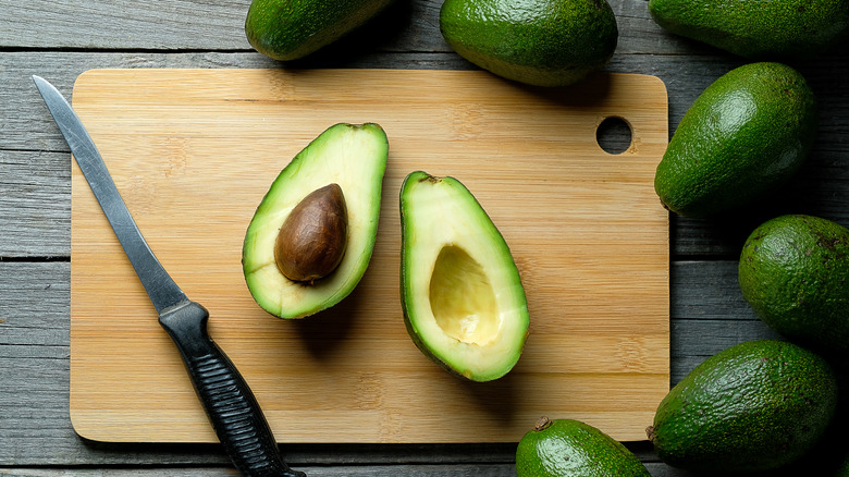 whole and halved avocados