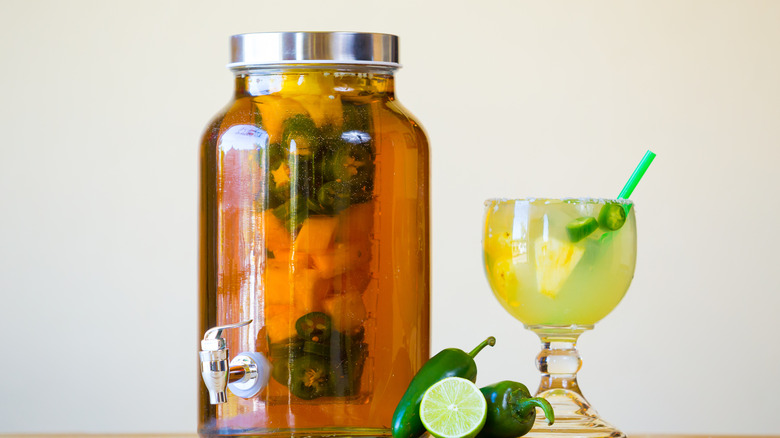 jar of infused tequila and margarita