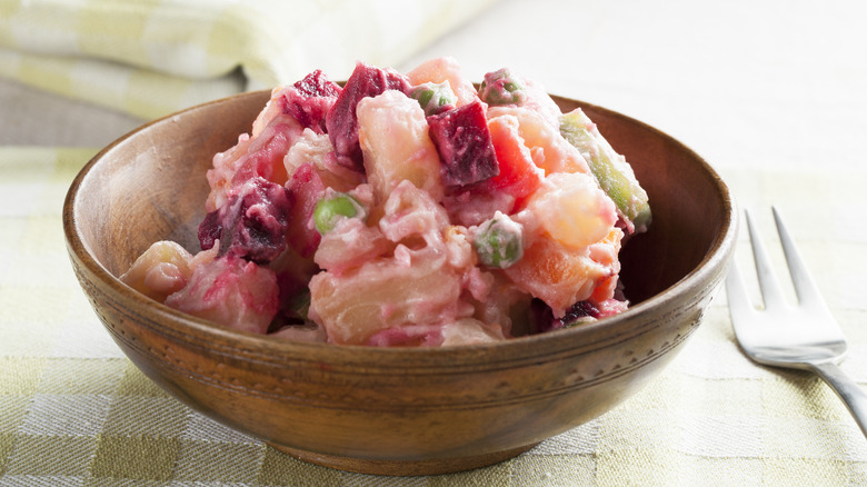 Beet and potato salad in brown bowl 