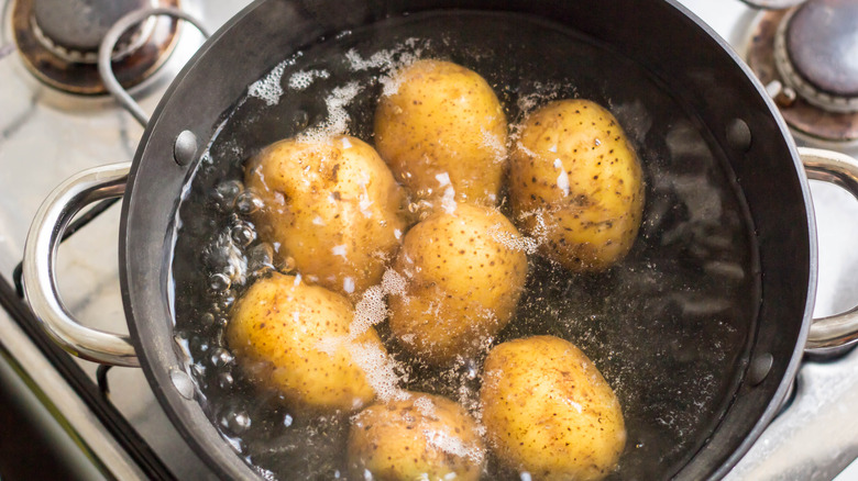 Potatoes boiling in a saucepan