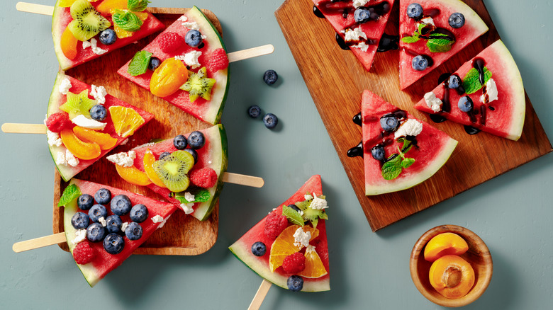 Garnished watermelon slices on sticks