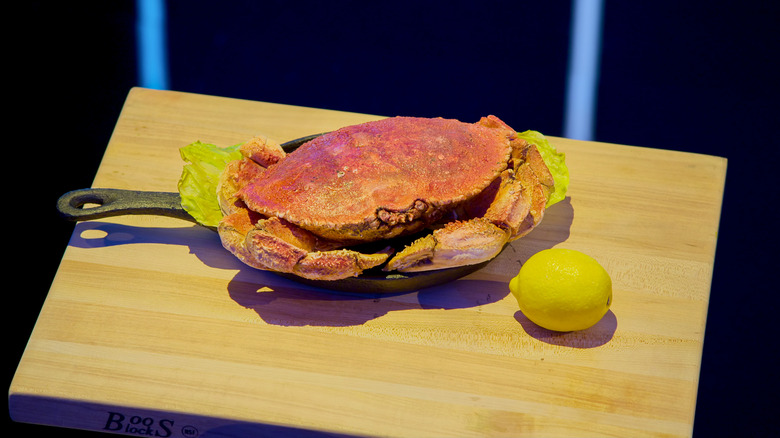 Crab-shaped cake on a cast iron pan