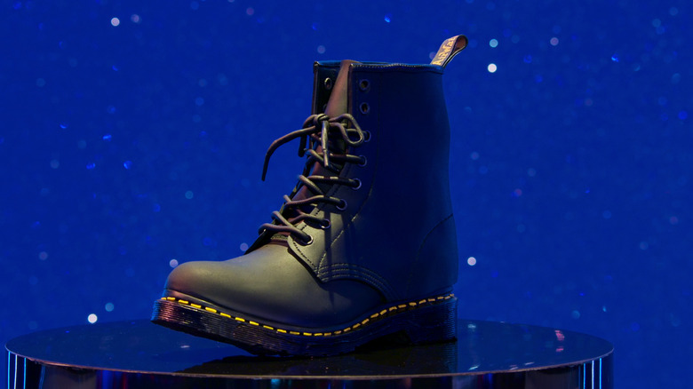 Doc Marten boot cake against a sparkly blue background