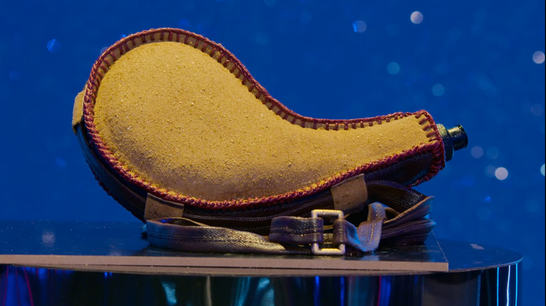 Fabric canteen cake against a sparkly blue background
