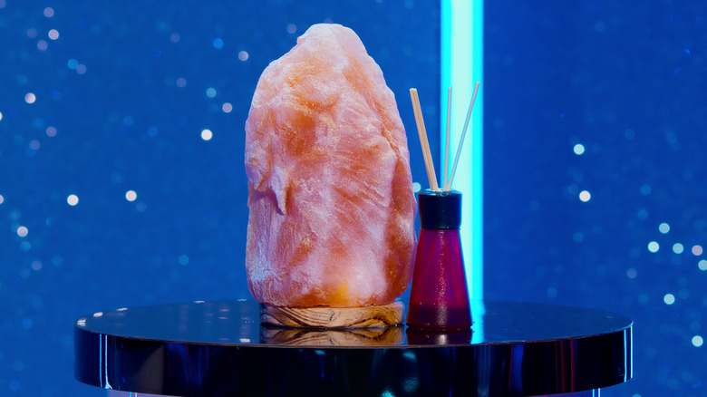Himalayan salt lamp and essential oil diffuser cake on a stand