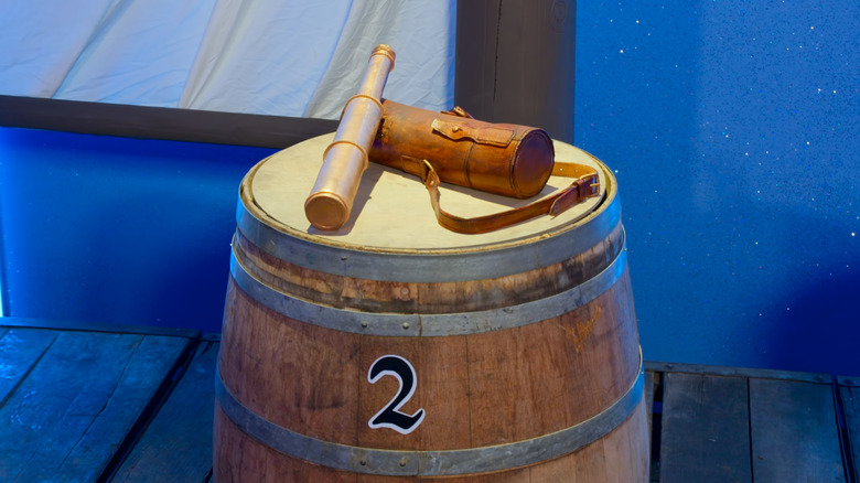 Spyglass and leather case on a barrel