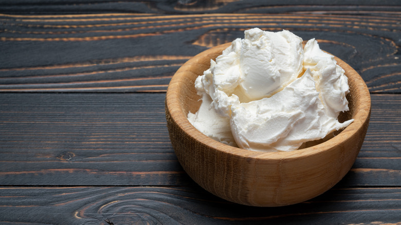 Mascarpone cheese in wooden bowl