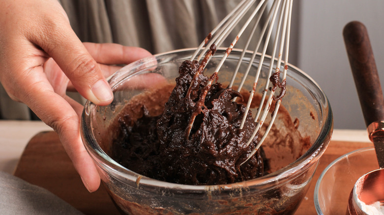 Whisking brownie batter in bowl