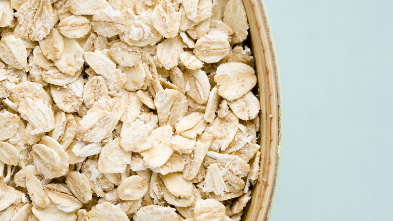 Oatmeal in bowl blue background