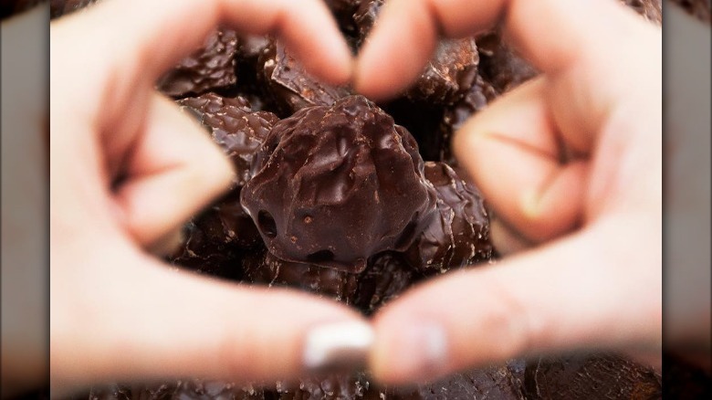 Hands around handmade chocolate