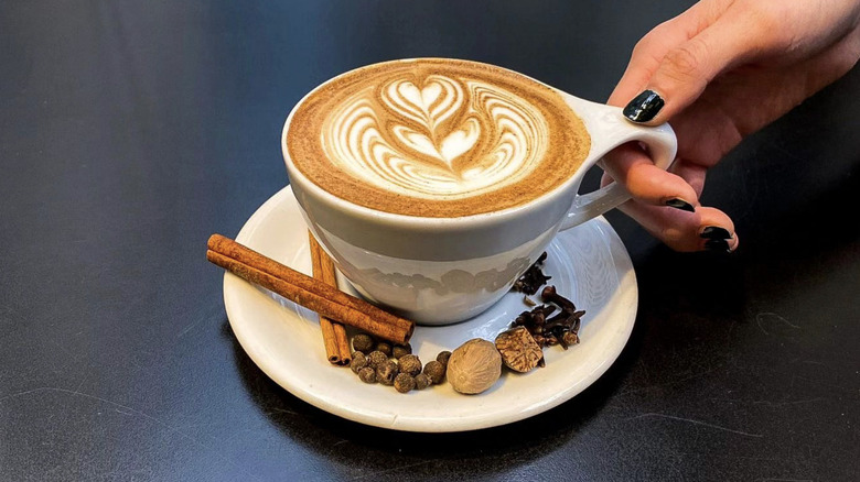 Person holding fall latte