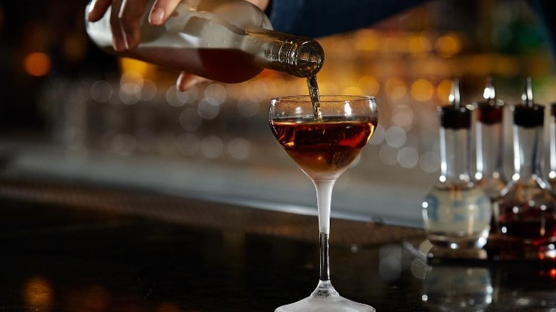 A cocktail being poured