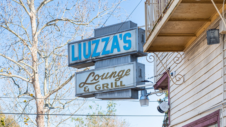 Liuzza's By The Track signage