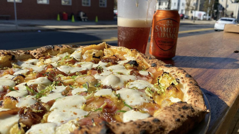 Pizza with beer on table