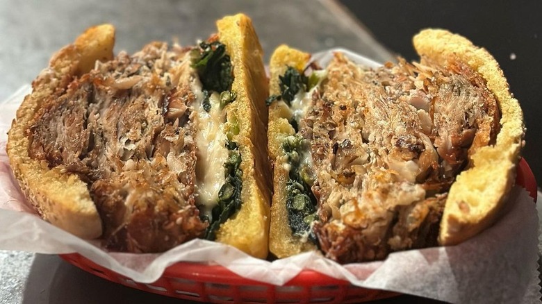 porchetta sandwich in basket