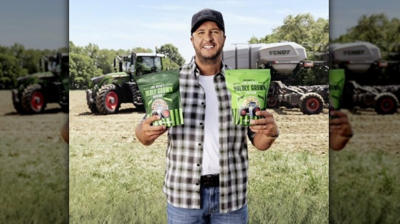 Luke Bryan holding popcorn