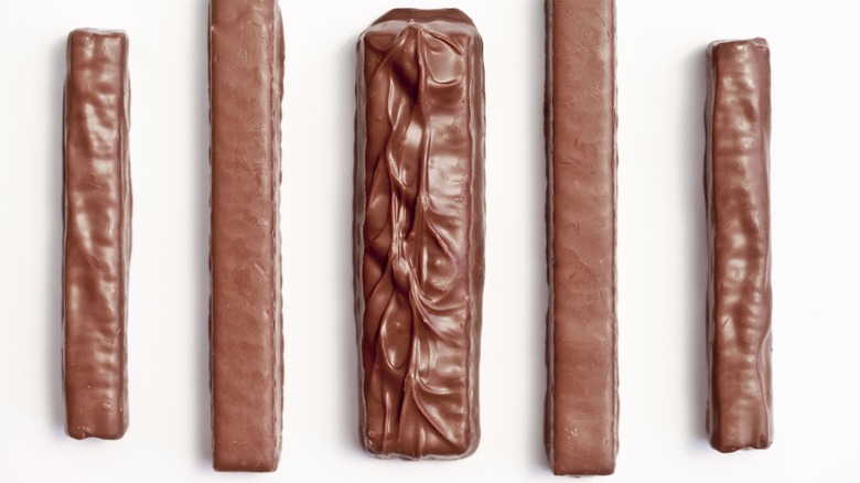 view of five chocolate bars on a white background