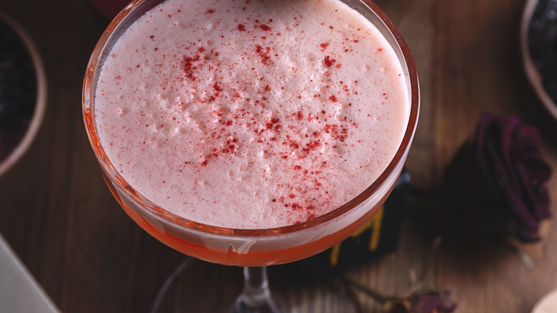 red cocktail in glass