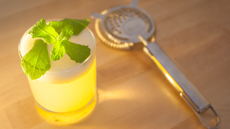 rum cocktail with froth mint