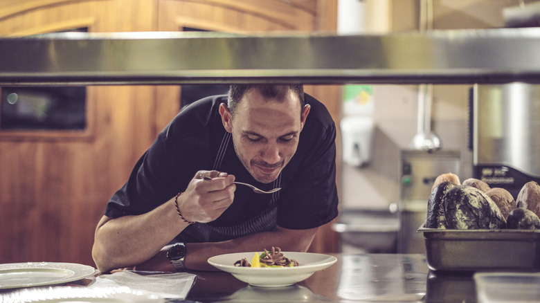 chef smiling and tasting