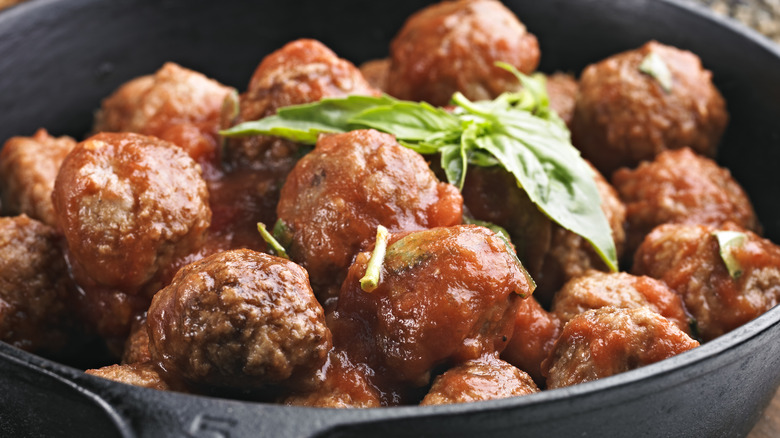 Crock of meatballs in tray