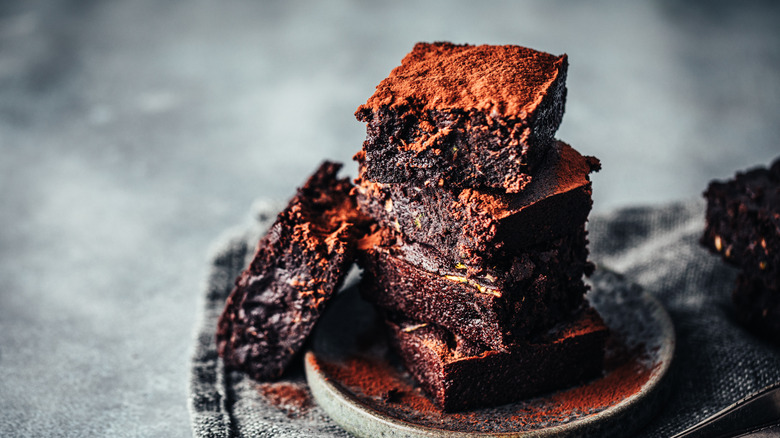 Stack of brownies on plate