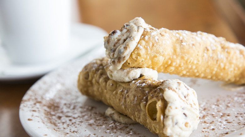 Cannolis on plate with ricotta