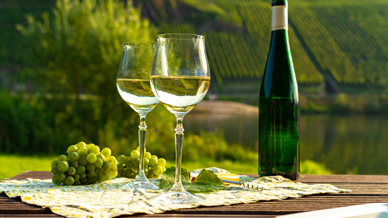 Bottle and glasses of Riesling with grapes